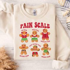 Pain Scale Shirt, Christmas Nurse Shirt, Funny Christmas Shirt, Medical Christmas Gingerbread Man Sweater,Nurse Triage Pain Assessment Shirt ----------------------------------------------------------------- ** How to order? ** 1. Please check all pictures and choose your T-shirt Size and Color. 2. Choose your quantity as much as you want. 3. Please enter custom Design Color and Personalization Box (if applicable) 4. PLEASE secure all steps of your order 5. After You add your note, Please Click "Proceed to Checkout" After selecting the order, please check the address and parameters again. Product Details:✨  INFORMATION  We offer a variety of shirts: * Adult Unisex Tee: 5.3-ounce, 100% cotton (99/1 cotton/poly (Ash) & 90/10 cotton/poly (Sport Grey), 50/50 cotton/poly (Dark Heather) Made with Nurse Christmas Shirts, Medical Christmas, Pain Assessment, Pain Scale, Man Sweater, Christmas Gingerbread Man, Christmas Gingerbread Men, Nurse Christmas, Funny Christmas Shirts