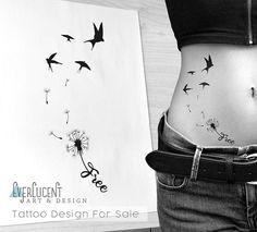 a woman with tattoos on her stomach next to a piece of paper