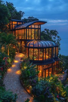 the house is surrounded by plants and trees