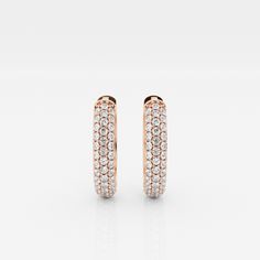 The Bombë Micro Huggie is a luxurious take on an everyday favorite. A miniature version of a classic hoop earring, these 14K gold diamond huggie earrings exude elegance and contemporary style. Three rows of lab grown pave diamonds embellish the curved shape of the earrings, encouraging you to dazzle from every angle. Luxury Rose Gold Huggie Earrings For Everyday, Luxury Rose Gold Small Hoop Diamond Earrings, Rose Gold Diamond Hoop Earrings With Brilliant Cut, Rose Gold Hoop Earrings With Brilliant Cut Diamonds, Formal Rose Gold Diamond Hoop Earrings, Classic Rose Gold Diamond Hoop Earrings, Luxury Rose Gold Huggie Earrings For Wedding, Rose Gold Diamond Hoop Earrings Fine Jewelry, Rose Gold Pave Set Huggie Hoop Earrings