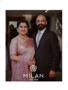 a man and woman standing next to each other in front of a photo with the words milan design on it