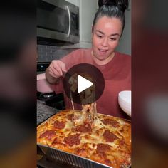 a woman is pouring pepperoni pizza sauce on top of the pizza in her kitchen