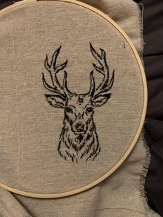 a deer's head is drawn on a piece of linen in this embroidery project