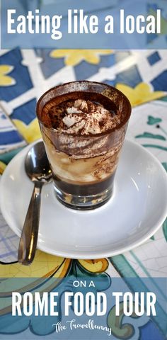 a white plate topped with a dessert on top of a table