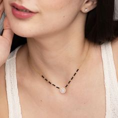 This beautiful mangalsutra necklace has a pendant which is that of a delicate zirconia studded... Women Mangalsutra Design, Short Mangalsutra Designs Gold, Chain With Black Beads, Modern Mangalsutra Designs, Modern Mangalsutra, Short Mangalsutra