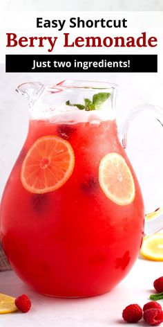 a pitcher filled with raspberry lemonade and garnish