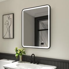 a bathroom sink sitting under a large mirror