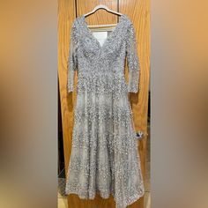 Silver/ Gray Waist 16" Bust 18" Shoulder To Shoulder 18" Sleeve 21 1/2" Full Length 60" Tag Size 42 Worn Once Normal Wear ( Some Loose Beads And Threads) Minor Alterations, But Reversed. Long Sleeve Formal Dress, Sleeve Formal Dress, Colorful Dresses Formal, Long Sleeve Dress Formal, Formal Dress, Loose Beads, Full Length, Long Sleeve Dress, Formal Dresses