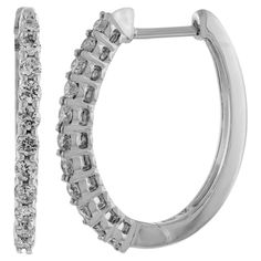 Nothing says luxury like an incredible pair of diamond round hoop earrings. These stunning brightly polished 14 karat white gold round-shaped hoop earrings feature a total of 24 round brilliant cut diamonds totaling .25 carats are prong set on the outside front creating a dose of incredible scintillation and fire. These are I-J color and I1/I2 clarity. Hinges on the bottom and click top posts secure these glamorous hoop earrings that are perfect for any occasion. Oval Hoop Earrings, Surgical Steel Earrings, Inside Outside, Jewelry Earrings Hoops, Oval Diamond, Round Brilliant Cut Diamond, Prong Setting, Diamond Bracelet, Gold Diamond