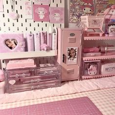 there are many pink items on display in this doll's room, including a locker and desk