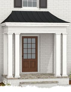 a white house with a brown front door