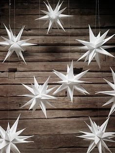 several white paper stars hanging from strings