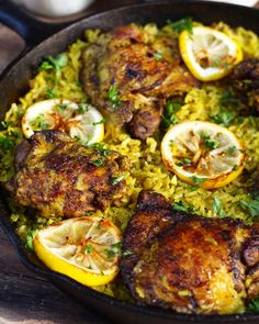 chicken and rice with lemons in a skillet