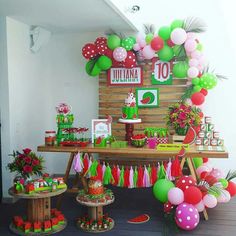 a birthday party with balloons and decorations