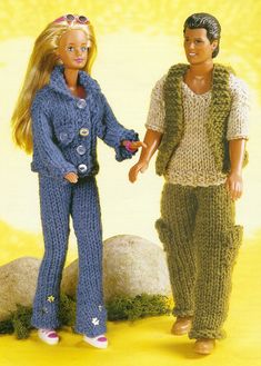 two barbie dolls standing next to each other on a yellow background with grass and rocks