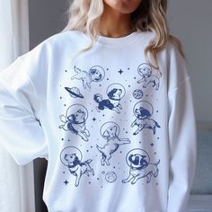 Dogs in Space Sweatshirt, Funny Dog Shirt, Dog Lover Sweatshirt, Oversized Sweatshirt, Vintage Retro Aesthetic Graphic, Unisex Sweatshirt 🧵 HOW TO ORDER   - Pick your size and color from the drop down menus  - Review the sizing and color options in the listing photos  - Add the item to your cart and complete the checkout process  - We'll start working on your order right away! 🧵SIZING  - Please review the listing photos to see the size charts  - These photos will also show you how to order a regular/relaxed fit or an oversized fit 🧵PRODUCT DETAILS  - This unisex heavy blend crewneck sweatshirt is pure comfort. These garments are made from polyester and cotton. This combination helps designs come out looking fresh and beautiful. The collar is ribbed knit, so it retains its shape even aft Space Sweatshirt, Dogs In Space, Vintage Retro Aesthetic, Dog Lover Sweatshirt, Sweatshirt Oversized, Funny Dog Shirts, Lover Sweatshirt, Sweatshirt Vintage, Funny Sweatshirts