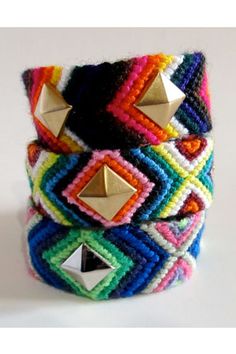 multicolored bracelet with gold pyramids and rivets on each one side