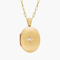 Carry loved ones close with this premium 14k yellow gold, oval locket featuring one round diamond. It opens with a snap clasp, holds two photos and is suspended from a 30-inch cable chain. This substantial locket can be engraved on the back for a personalized gift. Oval Locket Necklace, Oval Locket, Locket Necklace, Metal Necklaces, Cable Chain, Round Diamond, Chain Link, Locket, Round Diamonds