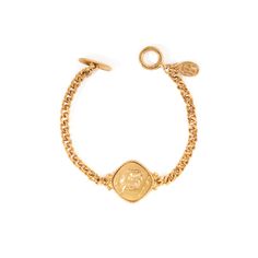 The Camille Bracelet from Laurine's Voyage Collection is a work of art. This intricate bracelet is made from tin alloy and then electroplated with 24kt gold. The Camille Bracelet measures 6.75" and has a toggle closure. Whether you're treating yourself or someone special, this bracelet is sure to impress. Made-to-order in our New York City Design Studio. Please allow 7-14 business days for production before the ship date. Adjustable Engraved Gold Metal Bracelet, Gold Metal Bracelet With Toggle Clasp, Gold Brass Bracelets With Toggle Clasp, Gold Engraved Metal Charm Bracelet, Engraved Gold Metal Charm Bracelet, Gold-tone Metal Bracelet With Toggle Clasp, Gold Metal Charm Bracelet With Toggle Clasp, Adjustable Gold Chain Bracelet With Toggle Clasp, Vintage Adjustable Gold-plated Bracelet