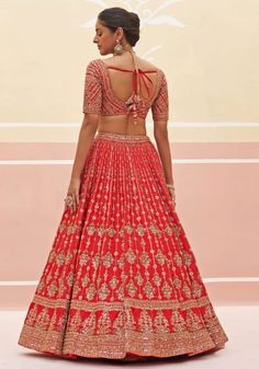 Step into the spotlight on your special day with our Red Silk Embroidered Bridal Lehenga. This exquisite ensemble features a radiant red raw silk lehenga, meticulously adorned with traditional zardozi embroidery, silken threads, dabka, cutdana, and sequins for a timeless elegance. Paired effortlessly with an embroidered red raw silk blouse and a matching red double dupatta, this bridal lehenga is the perfect choice for your wedding day. Composition : Lehenga and Blouse - Raw Silk, Dupatta - Soft Net Care: Dry Clean Only and Vacuum Storage This product can be customized for sleeves, length of blouse and neckline Delivery : 2-4 weeks as the product is hand crafted. Check Size Guide or choose MySize for free customisation (All Sizes above XL can be made at 15% additional cost) For more inform Floral Bridal Lehenga, Double Dupatta, Embroidered Bridal Lehenga, Lehenga Pattern, Raw Silk Lehenga, Floral Lehenga, Zardozi Embroidery, Radiant Red, Vacuum Storage