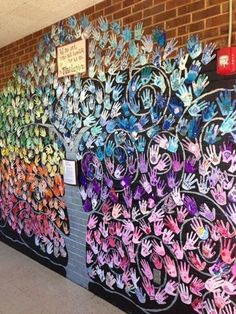 an image of a wall with flowers painted on it and the words collaborative mural on side of the building