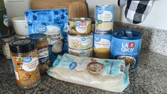 an assortment of food items sitting on top of a counter