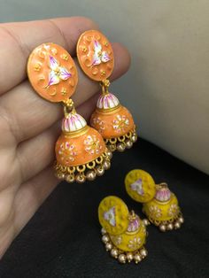 Very stylish and vibrant colors meena work jhumka earrings. Stunningly made designs with all the love and hand painted meena kari, perfect match for a perfect outfit! Grab all the lovely new arrivals we have! Colors : yellow, orange In stock and ready to wear. Multicolor Meenakari Jhumkas Drop Earrings, Multicolor Jhumkas With Matching Earrings For Diwali, Multicolor Jhumkas For Diwali With Matching Earrings, Handmade Temple Jewelry Jhumkas Drop Earrings, Handmade Temple Jewelry Style Jhumkas, Handmade Jhumkas As A Gift, Handmade Temple Jewelry Jhumkas, Festive Bohemian Meenakari Jhumkas, Bohemian Style Festive Meenakari Jhumkas