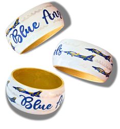 Hey Blue Angels Fans! Excitement is in the air as the Blue Angels get ready to soar over the Naval Academy in Annapolis! To celebrate this breathtaking event, we're thrilled to introduce our exclusive hand-painted Blue Angel wooden bangle. 2.8inch Round Large Wooden Bangle 1.5 inch Wide/ Personalization include and available upon request Each bangle is meticulously crafted and painted by hand, ensuring that no two pieces are exactly alike.  ✨ Handcrafted Quality: Each bangle is made from high-qu Painted Wood Jewelry, Wooden Bangle, Naval Academy, Blue Angel, Blue Angels, Gold Cuffs, Wood Jewelry, Hand Painted Wood, Wood Jewellery