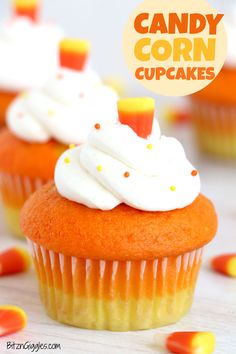 candy corn cupcakes with white frosting and sprinkles on top