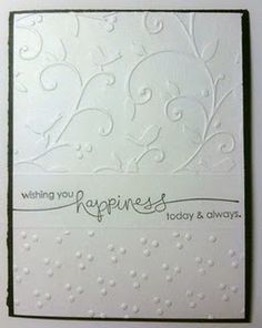 a white greeting card with an ornate design