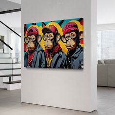 three monkeys on yellow and red painting in modern living room with staircase leading up to second floor