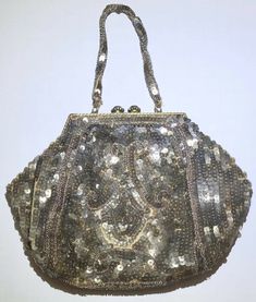 Lined inside. Flower and rhinestone closure and metal frame. Beaded handle and fully beaded bag. Vintage bag. Condition is Pre-owned. Shipped with USPS Priority Mail. Evening Handheld Sequin Bag, Elegant Handheld Sequined Bags, Embellished Formal Pouch Bag, Glamorous Formal Shoulder Bag With Sequins, Formal Embellished Pouch Bag, Gold Sequined Shoulder Bag For Evening, Glamorous Embellished Bags, Elegant Gold Bags With Sequins, Formal Rectangular Bags With Sequins