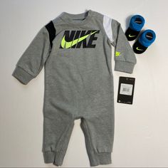 Nike Baby Long Sleeve Coverall And Booties From Nike! Price If Firm. No Offers, Please! Ty! Brand New With Tags! Soft Cotton Blend Delivers Comfort, While The Screen Print Graphics Ensure Your Baby Will Be The Most Stylish One On The Block. Sz 6m Romper: Long Sleeve, Shoulder Snaps & Full Leg Snaps For Easy On And Off, Nike Graphics On Front, Dark Grey Heather Color & 60% Cotton, 40% Polyester. Booties: Adorable Look With Embroidered Nike Swoosh Logo, Matching Colors, & Cotton Blend. Smoke And P Casual Gray Onesie For Playtime, Baby Jordan Outfits, Nike Jogging Suits, Nike Graphics, Reborn Clothes, Grey Sweatsuit, Newborn Necessities, Leg Snaps, Black Tracksuit