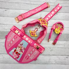 a pink toy set with matching accessories on a wooden floor