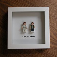 two legos are in a white frame with the words i love you, i know