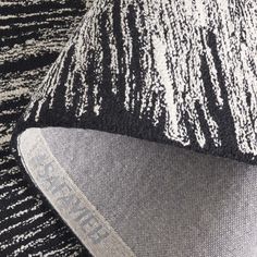 a close up view of a black and white hat