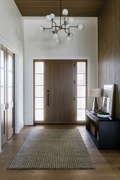 a large hallway with wooden paneling and white walls