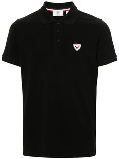 black cotton piqué weave polo collar appliqué logo at the chest short sleeves ribbed cuffs straight hem short front button fastening Classic Black Top With Logo Patch, Black Collared T-shirt With Embroidered Logo, Black Cotton Polo Shirt With Embroidered Logo, Cotton Polo Shirt With Logo Patch, Black Polo Shirt With Button Closure, Cotton Polo Shirt With Logo Patch And Short Sleeves, Casual Cotton Polo Shirt With Logo Patch, Classic Black Polo Shirt With Button Closure, Casual Short Sleeve Polo Shirt With Logo Patch