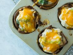 an overhead view of some food in a muffin tin