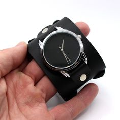 Cool urbanistic cuff watches with handmade leather wristband with two buckles. Void minimalist matte black dial without indications or numbers.  Watches installed on extra wide wrist cuff (50mm width), also double belt well fix your wrist.  Installed Japanese movement inside powered by battery.  This watches can be a great gift for all urban people.  Size of case is 40mm, so it's not huge and fit men or women wrist.  In this watches we use this our Depp style watch band https://www.etsy.com/list Black Minimalist Adjustable Watch, Urban People, Double Belt, Black Leather Watch, Leather Wristbands, Cuff Watch, Style Watch, Leather Watch Strap, Fit Men