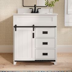 a bathroom vanity with drawers and a mirror