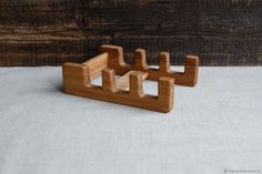 two wooden objects sitting on top of a table