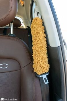 the interior of a car with a cleaning brush in it