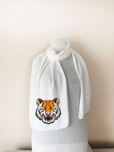 "Introducing our \"Tiger Scarf\" - the perfect tiger gift for tiger lovers! The intricate detailing captures the essence of the majestic creature, from the intense gaze to the striking stripes, evoking a sense of power and beauty.Whether for a dedicated wildlife enthusiast, a symbol of strength for a friend, or a captivating piece of accessory for your space, our Tiger Gifts offer a wide range of options to choose from.  Measuring approximately 64.1 inches long and 13.7 inches wide, teacher scar Tiger Scarf, Tiger Gifts, Paris Gifts, Symbols Of Strength, Chiffon Material, Chiffon Fabric, Shawls And Wraps, Scarf Wrap, Different Styles