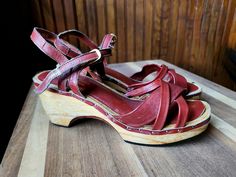 Vintage 1960's wood and leather wedged summer heels Strappy heeled sandals in a dark red shade A very classic summer heel! In ok condition. Visible wear due to age! they still have some love in them and are priced accordingly. Brand - Unknown Size Listed - No size Listed. Was found at a house where all the other shoes were a vintage size 9 Fits Best - Women's 7 1/2 or 8 Length - 9 1/4" Width at toe - 2 7/8" Heel Height - 2 3/4" Genuine leather material Priced as is. No returns or exchanges Leather And Wood, Summer Wedges, Summer Heels, Strappy Sandals Heels, Heeled Sandal, Platform Wedge, Leather Wedges, Heel Shoes, Platform Wedges