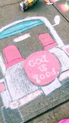 a child's chalk drawing of a car on the sidewalk next to a skateboard