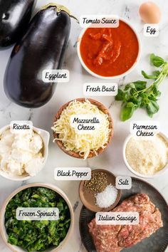 the ingredients to make an eggplant parmesan soup on a marble countertop