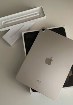 an apple ipad is sitting in its box next to the packaging for it's new model