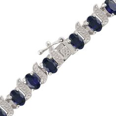 This 6.0 x 4.0mm oval lab-created blue sapphire and diamond accent cascading bracelet set in sterling silver measures 7.0 inches in length and secures with a tongue and groove clasp. Blue Oval Diamond Bracelet For Anniversary, Oval Sterling Silver Bracelet Fine Jewelry, Oval Sterling Silver Bracelet, Oval Sapphire Bracelets For Anniversary, Elegant Sterling Silver Bracelet With Oval Gemstone, Blue Oval Sterling Silver Bracelet For Formal Occasions, Elegant Oval Sapphire Tennis Bracelet, Oval Sapphire Bracelets In White Gold, Blue Oval Diamond Bracelet With Jewels