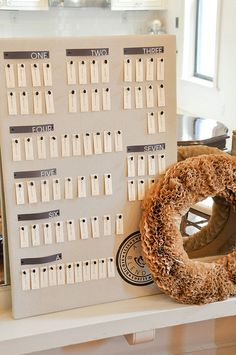 a table with a wreath and calendar on it